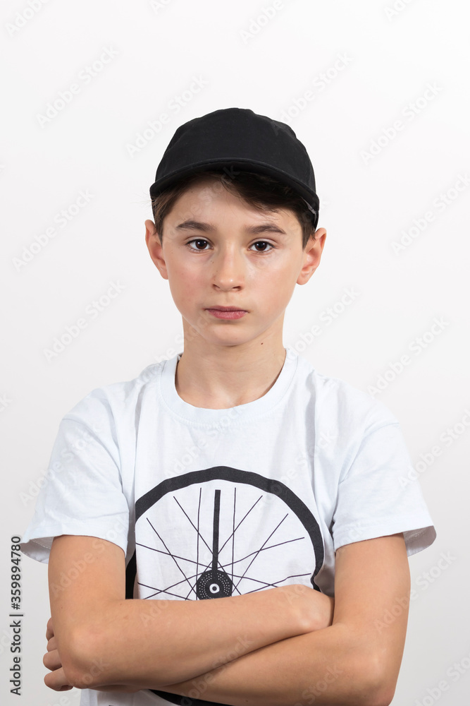 Teenage boy in white shirt. Portrait in studio. Funny faces.