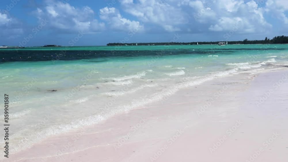 Turquoise Caribbean sea with clear light beach waves upon the sandy beach. Turquoise Caribbean sea with clear light beach waves upon the sandy beach.