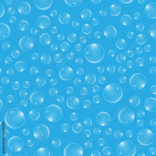 Vector illustration. Seamless pattern. Transparent drops of different sizes in random order on a light blue background.