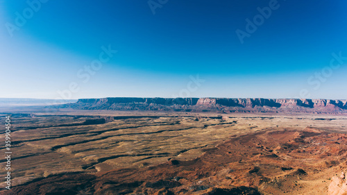 Aerial view of beautiful rocky mountain range. Bird s eye scenery view red cliff in area of desert landscape of United states. Environment with dry climate