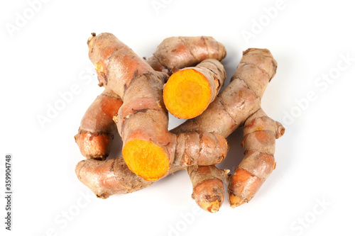 Fresh turmeric (Curcuma) rhizome on white background. herbal photo