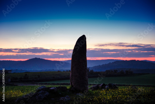 menhir in spain at the fall of the sun