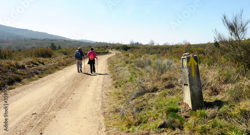 Pilgrims on the Camino de Santiago, Camino Sanabres from Campobecerros towards the town of Laza, Orense province, Spain photo