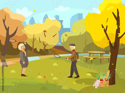 Vector illustration of senior couple playing badminton in autumn park. Fall park scene. Picnic basket. City silhouette at the background. Cartoon style.