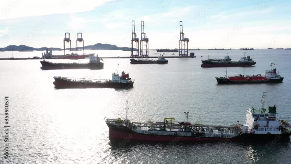 Oil tanker and LPG tanker parking at sea oil port terminal, Aerial view oil and gas petrochemical tanker offshore in open sea, Refinery industry cargo ship. Oil tanker and LPG tanker parking at sea oil port terminal, Aerial view oil and gas petrochemical tanker offshore in open sea, Refinery industry cargo ship.