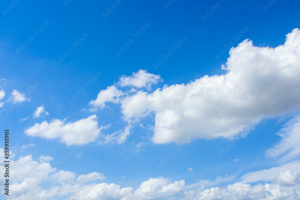 Fototapeta premium Cirrus and cumulus clouds on blue sky background.
