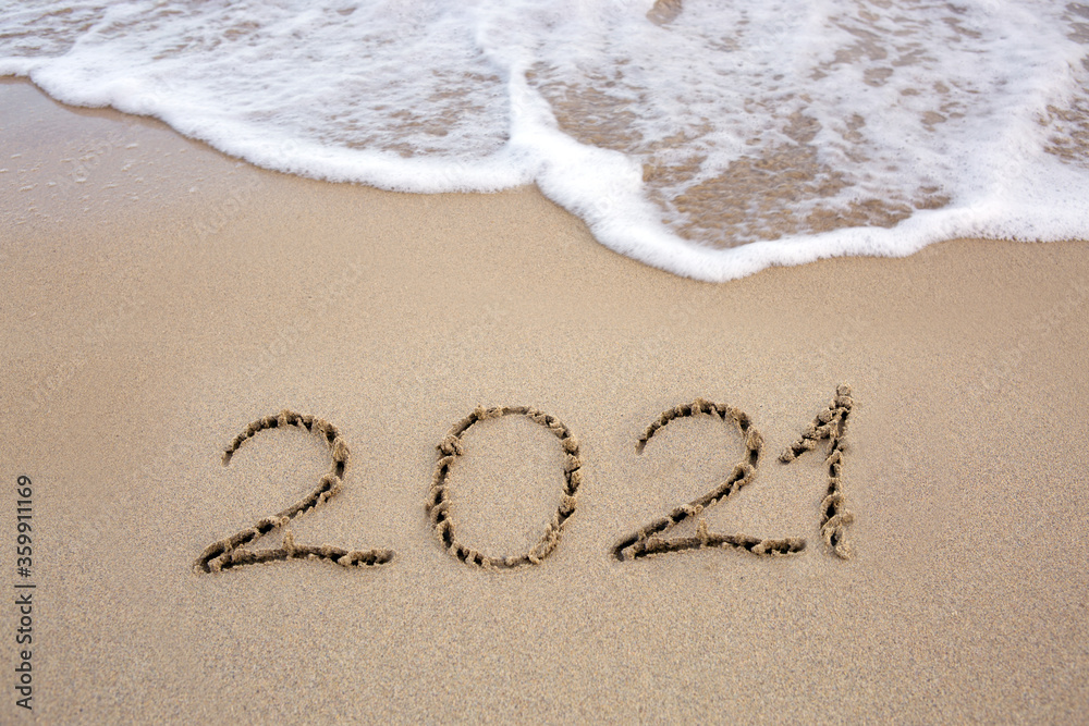 Fototapeta premium Year 2021 written at the caribbean sand beach with sea wave .