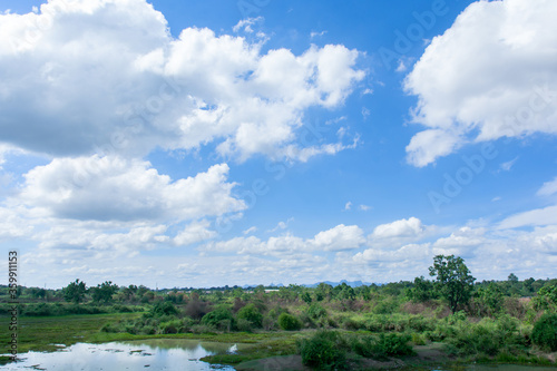 Cirrus and cumulus clouds on blue sky background.