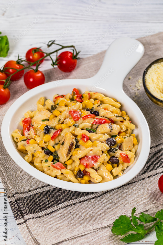 Cheesy Grilled Chicken Alfredo Pasta Florentine with Black Beans and Corn. Selective focus. Cheesy Grilled Chicken Alfredo Pasta Florentine with Black Beans and Corn. Selective focus.