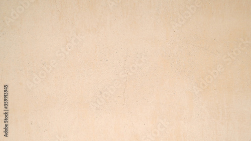 brown sand stone wall for background, concrete floor