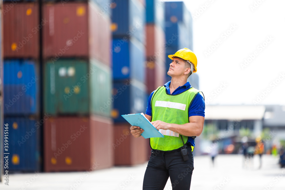 supervisor inspects wearing hardhat safety helmet working and checking control container shipping terminal at shipping port for import and export supervisor inspects wearing hardhat safety helmet working and checking control container shipping terminal at shipping port for import and export