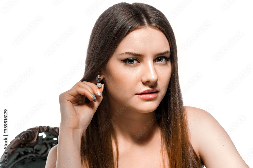 slender girl in overalls. Sports girl in tight clothes. Athletic brunette on a white background slender girl in overalls. Sports girl in tight clothes. Athletic brunette on a white background