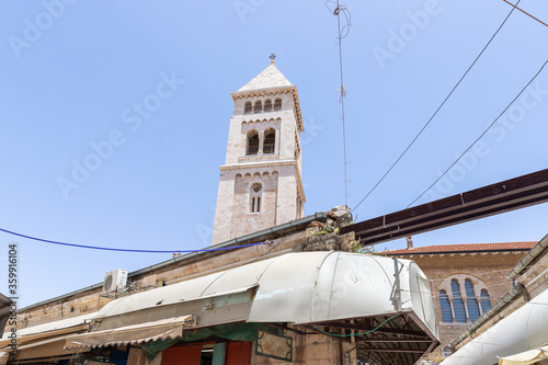 The bell tower of Lutheran Church of the Redeemer rises above the ranks of the Arab Bazaar in the old city of Jerusalem, Israel