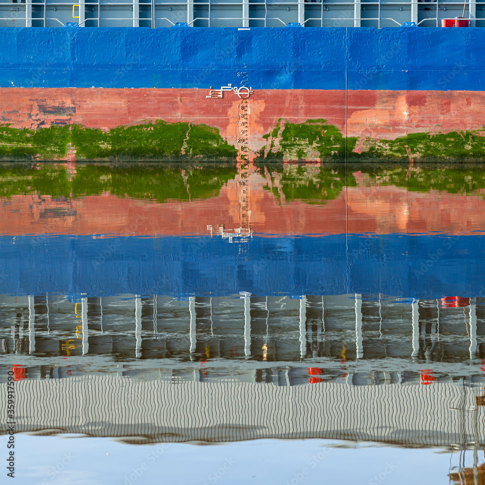 Plimsoll line with refection in still water.