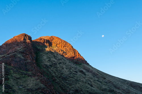 Part of Brukkaros mountain, an extinct volcano with moon visible photo