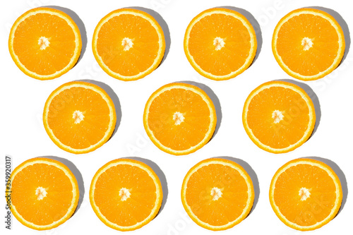 Collage of cut oranges. Orange on a white background.
