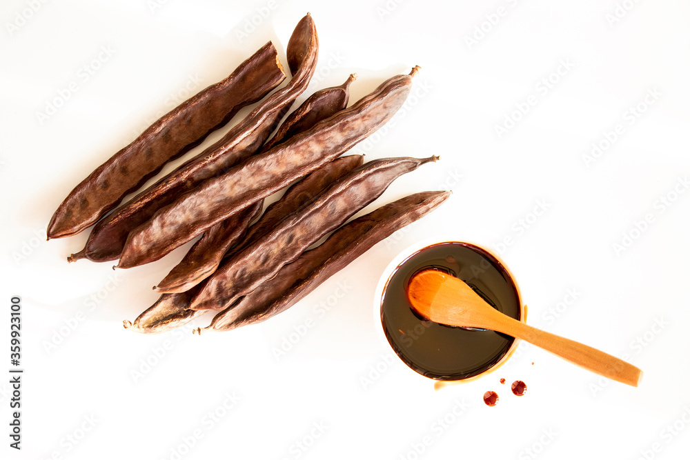 Goat horn and molasses. Photo of molasses on a white background. Stock