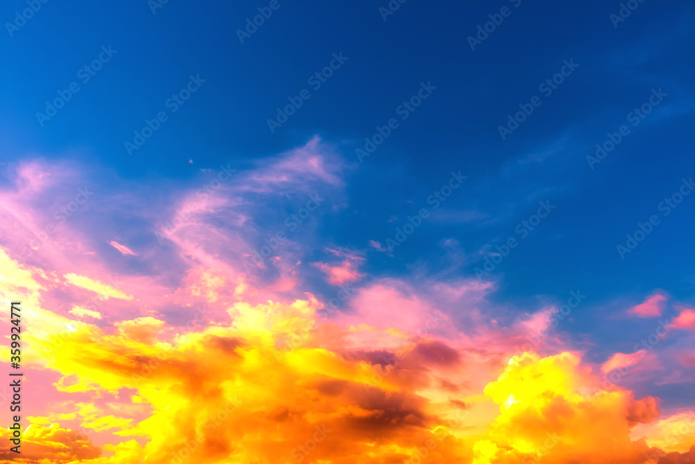 sky and clouds nature background,bright orange with pink color on soft clouds in deep blue sky sky and clouds nature background,bright orange with pink color on soft clouds in deep blue sky