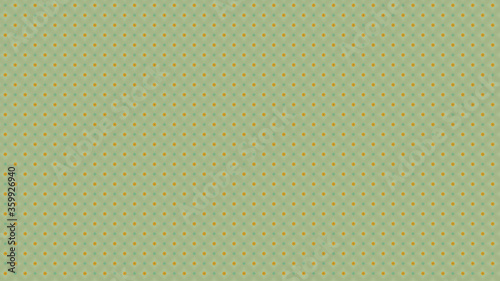 Yellow speckles on a green background resembling fruit with spots, suitable for textile work