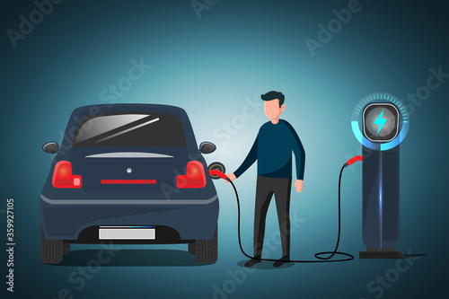 Dark blue electric car at the charging station with a young man holding the cable night view