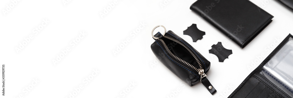 Fashionable black leather male accessories isolated on white background. Male accessories Fashionable black leather male accessories isolated on white background. Male accessories