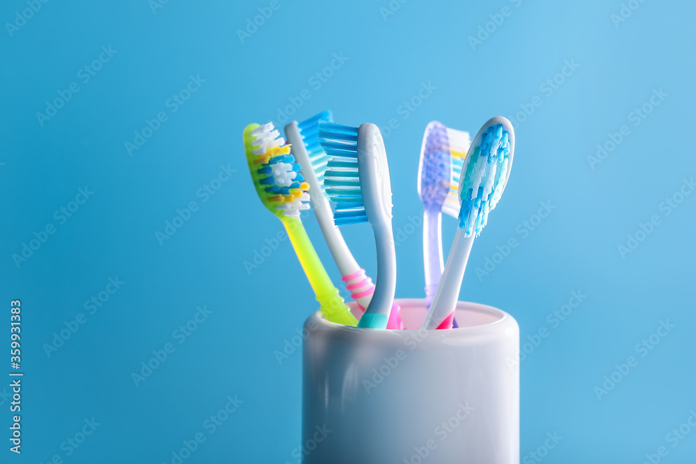 Plastic colorful toothbrushes in cup Plastic colorful toothbrushes in cup