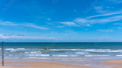 Tropical beach with gentle sea waves and cloudy skies In Chanthaburi province, Thailand, horizon, seascape, sea connect to the sky 