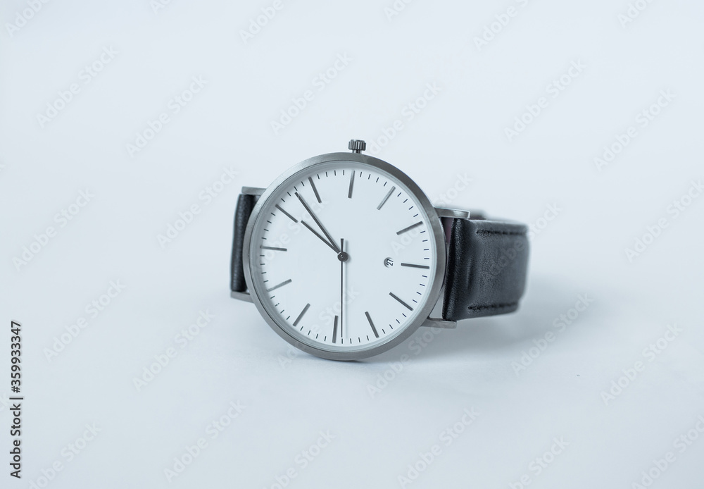 Hand Watch Isolated on White Background. Men's silver watch with a black strap. Hand Watch close up. Hand Watch Isolated on White Background. Men's silver watch with a black strap. Hand Watch close up.