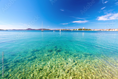 Fototapeta Naklejka Na Ścianę i Meble -  Bay of adriatic sea with town on horizon