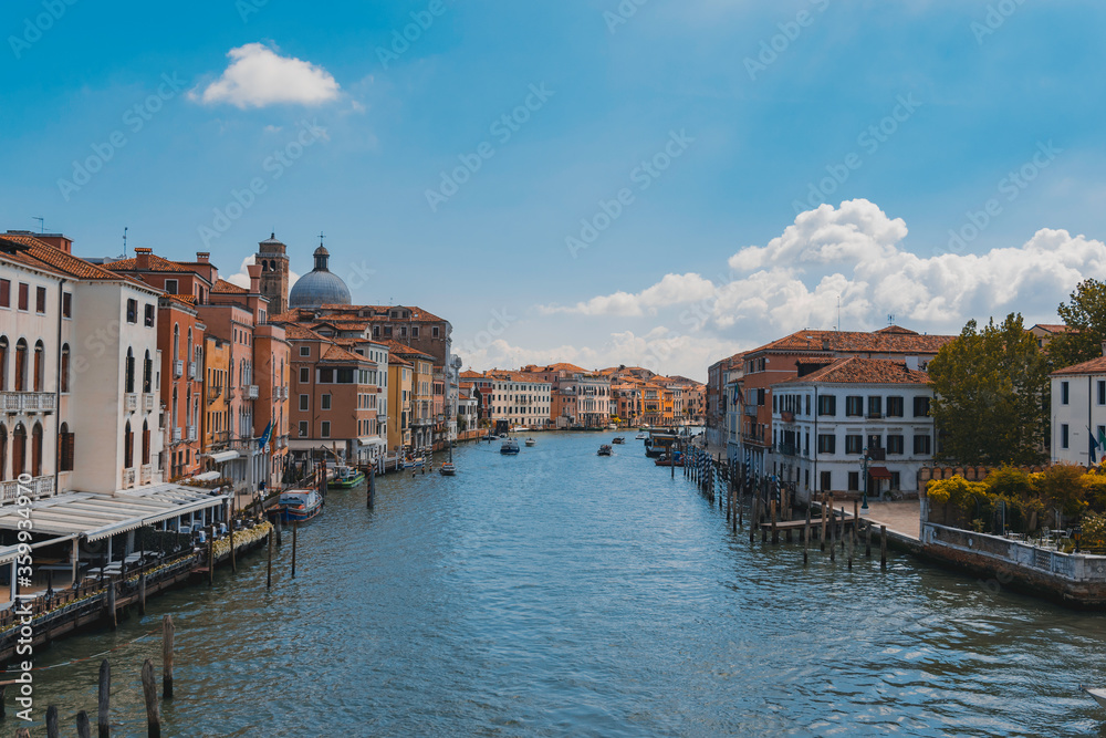 View of the grand canal in Venice, Italy, with ancient buildings, boats and docks
