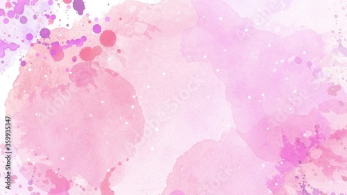 Beautiful colorful watercolor ink drops on white paper and star glitter.