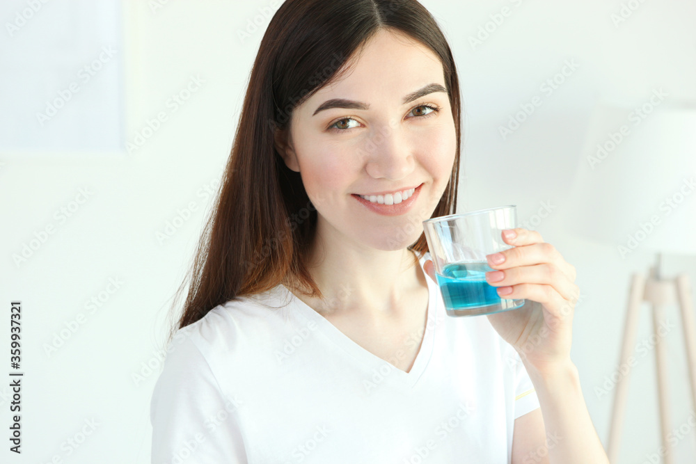 young girl uses mouthwash at home
young girl uses mouthwash at home