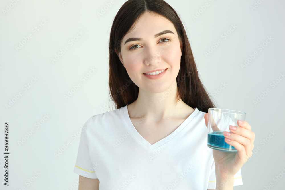 young girl uses mouthwash at home
young girl uses mouthwash at home