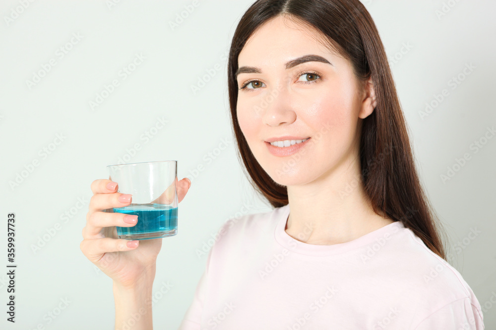 young girl uses mouthwash at home
young girl uses mouthwash at home