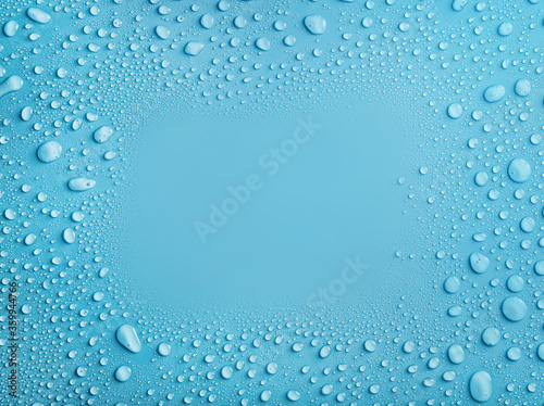 Slika na platnu Water drops frame on blue background