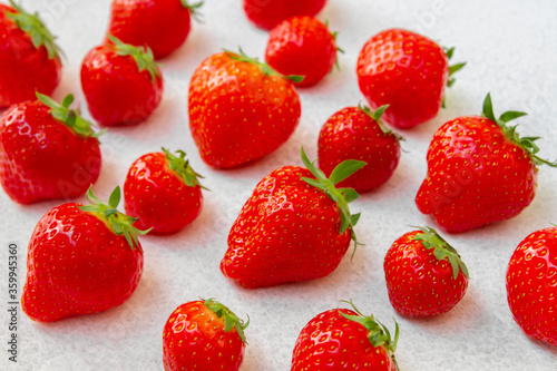 A lot of strawberries on a white background.