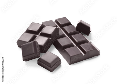 Pieces of delicious dark chocolate isolated on white