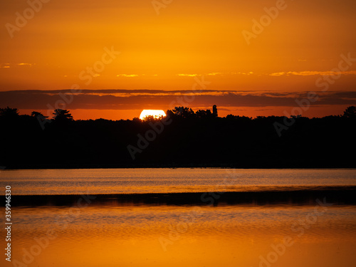 sunrise in the Salina dei Monaci Nature Reserve, an old salt pan at Torre Colimena, Taranto, Apulia, Italy photo