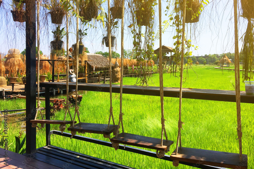 Fototapeta premium Swing in the middle of the field with beautiful nature