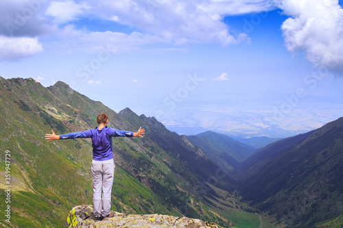 Hiker looks at the beautiful Romanian Carpathians, Fagerash array photo