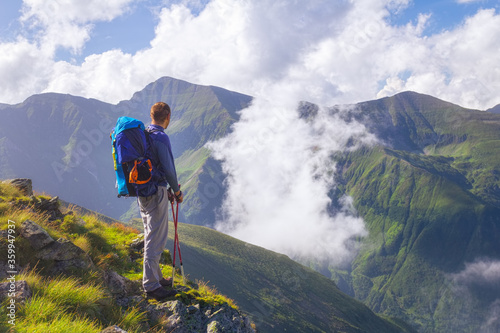 Hiker looks at the beautiful Romanian Carpathians, Fagerash array photo