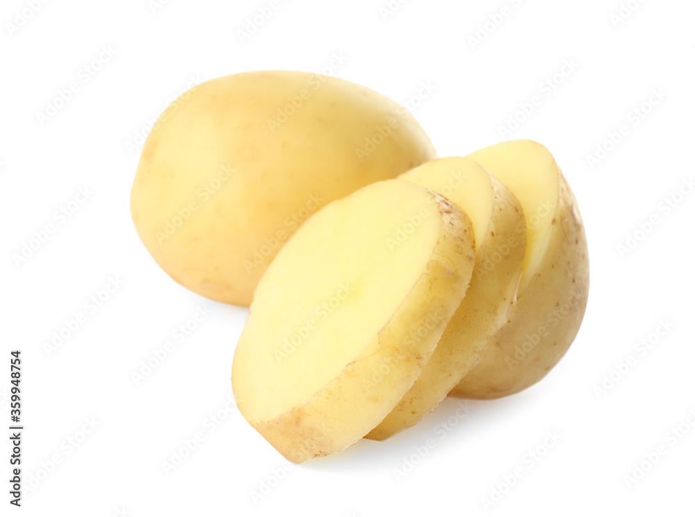 Whole and cut fresh raw organic potatoes on white background