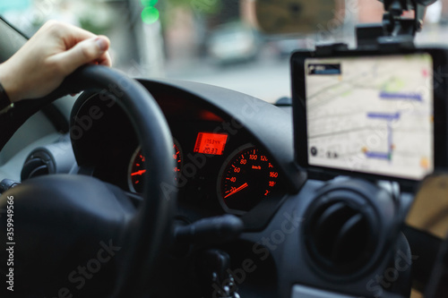 View of a speedometer, steering wheel and navigator on a dashboard © Volodymyr Herasymov