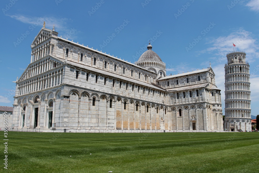 the leaning tower and cathedral in the beautiful square of miracles in Pisa