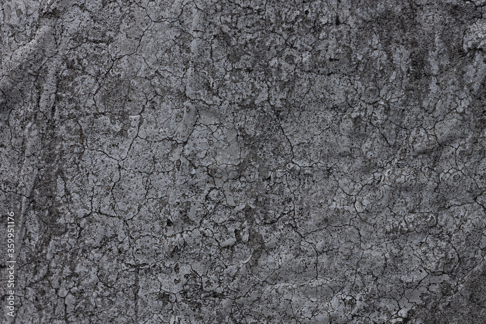 Dark grey aged paint background with cracks. Black brick stone texture used for wallpapers, your text sign. Cement blocks backdrop for advertising design mockup. Architecture details. Dark grey aged paint background with cracks. Black brick stone texture used for wallpapers, your text sign. Cement blocks backdrop for advertising design mockup. Architecture details.