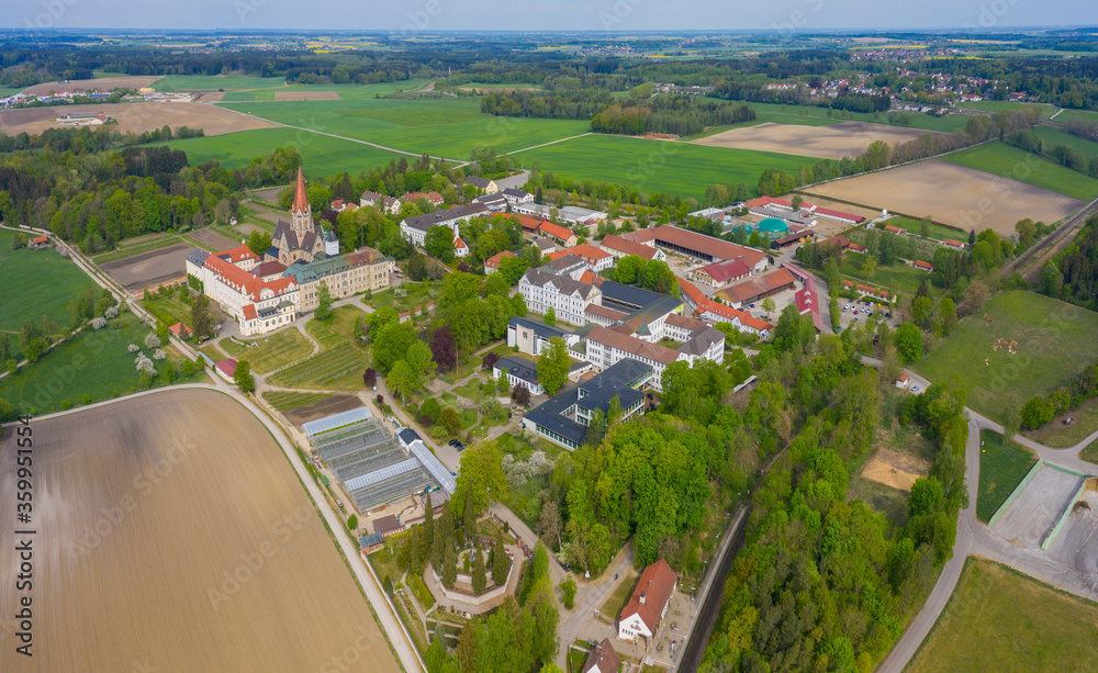 Aerial view of the monastery St. Ottilien close to Eresing in Germany, Bavaria on a sunny spring day during the coronavirus lockdown.
