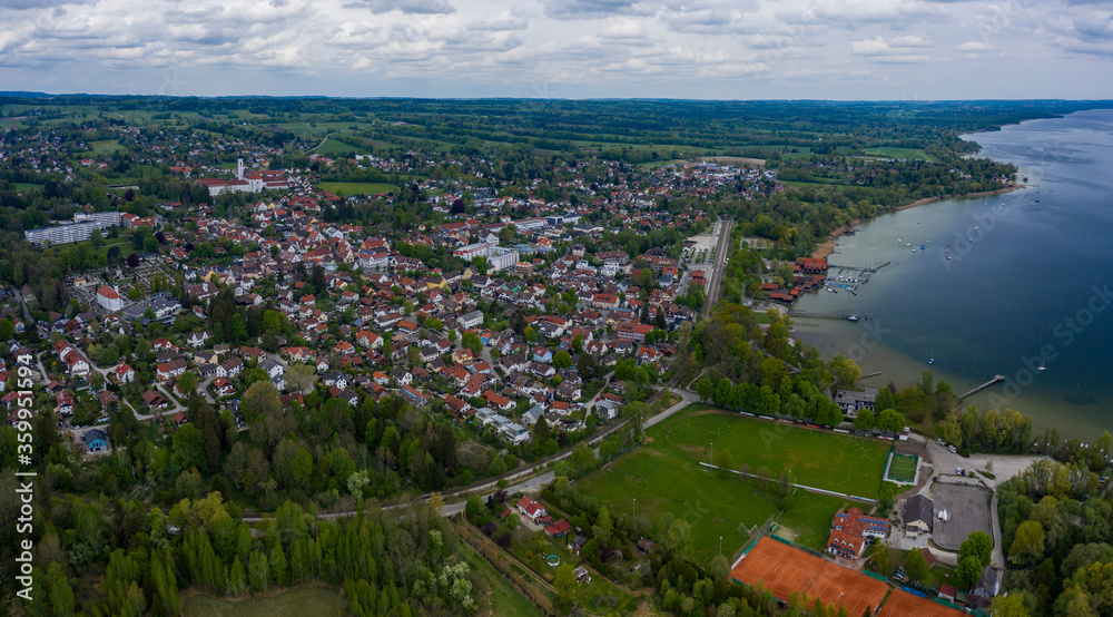 Aerial view of the city and monastery Dießen am Ammersee in Germany, Bavaria on a sunny spring day during the coronavirus lockdown.
