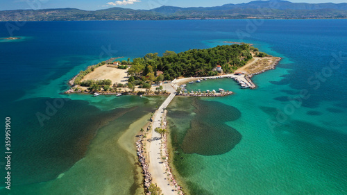 Aerial drone photo of famous island of dreams or Pesonisi connecting with small road with seaside fishing village of Eretria, Central Evia island, Greece