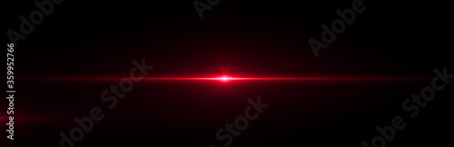 Red lens flare light on black background photo