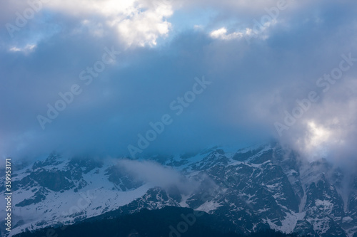 mountain peak and blue clouds in the morning 